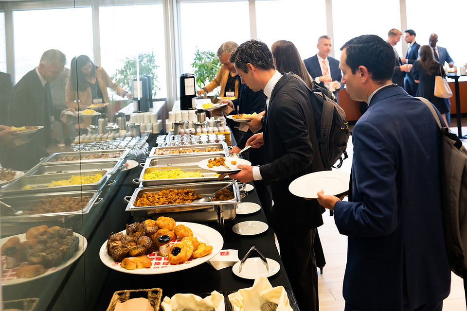 event attendees grabbing breakfast