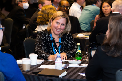 attendees at corporate event talking around a table