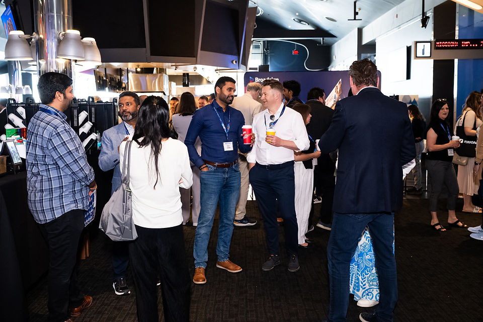 conference attendees mingling at an event at the Scotiabank Theatre