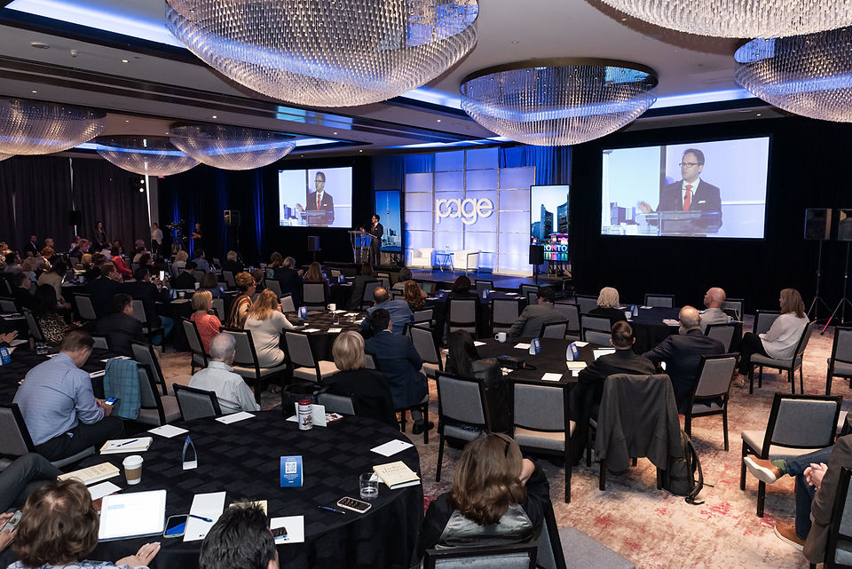 wide shot of conference room with attendees