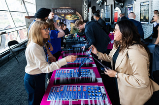 Conference attendees signing in at an event at the Scotiabank Theatre