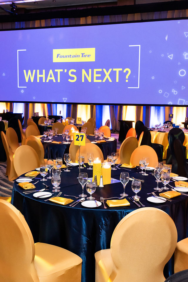 table setting in a ballroom at an event