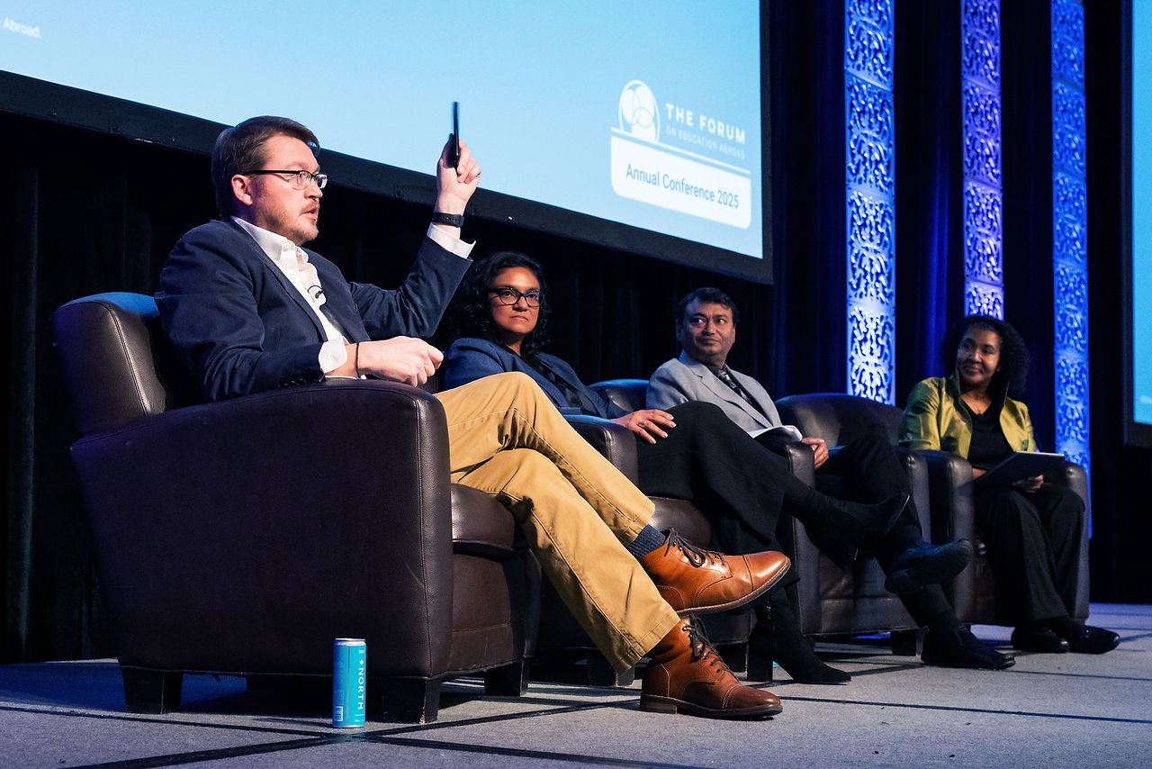 four panelists on stage at an event
