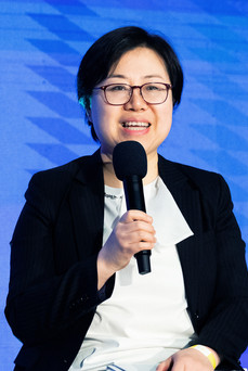 smiling woman speaker with microphone