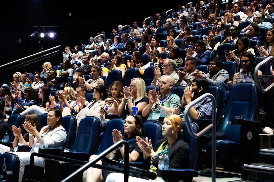conference audience at the Scotiabank Theatre