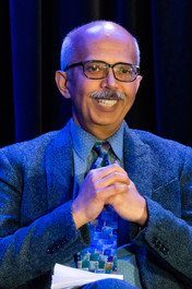 close-up of smiling male panelist