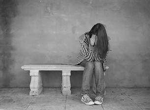 Woman crying on the bench