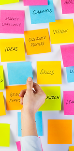 Colorful Sticky Notes with a Hand Choosing One