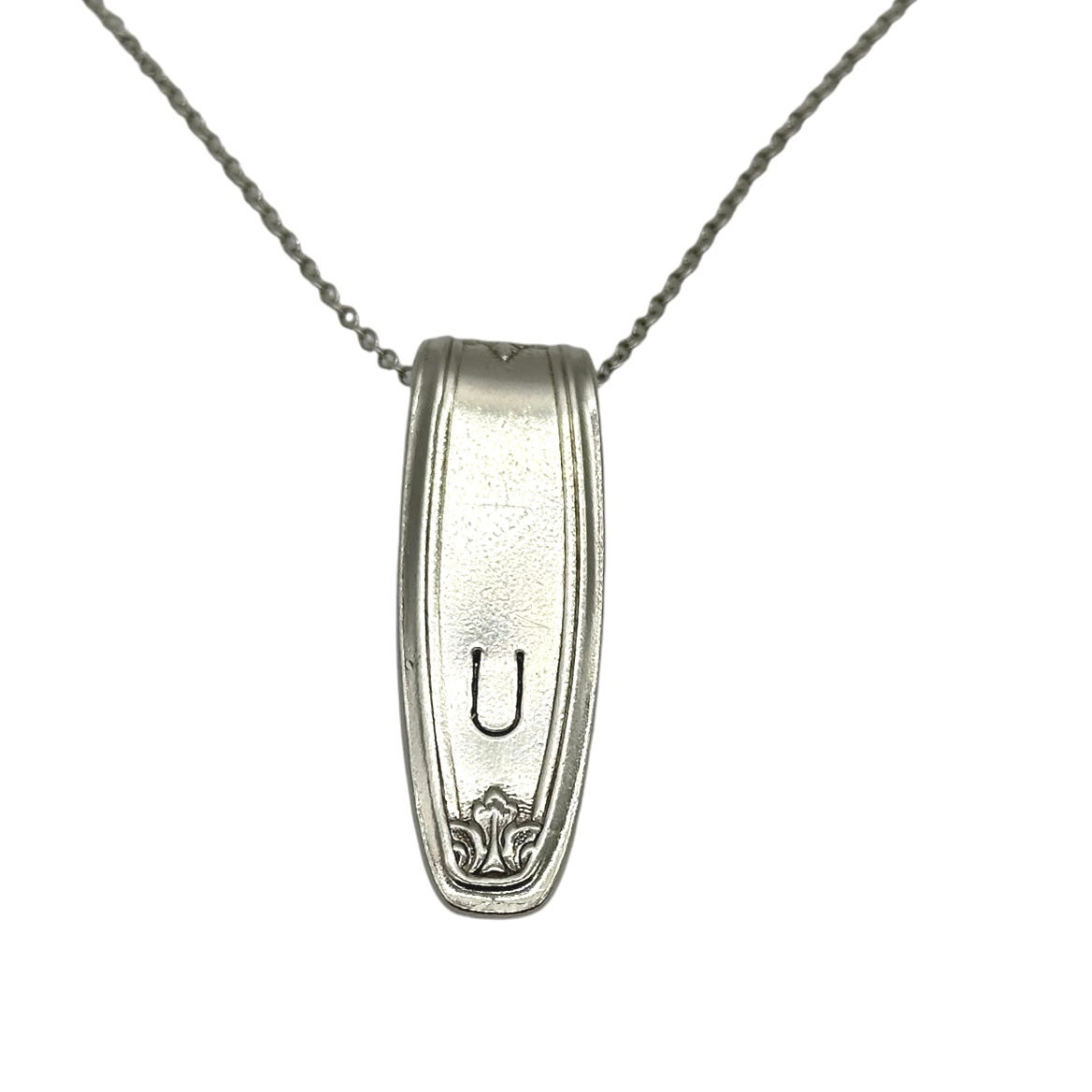 (U) Monogrammed necklace.