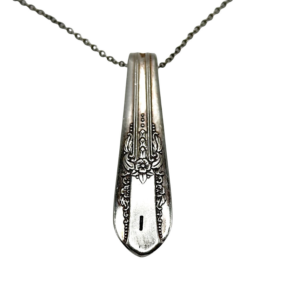 (I) Monogrammed necklace.