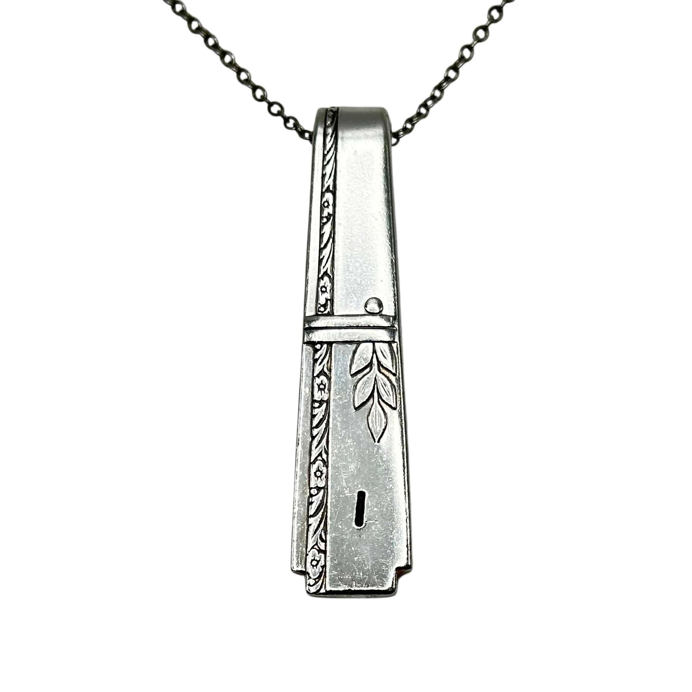 (I) Monogrammed necklace.