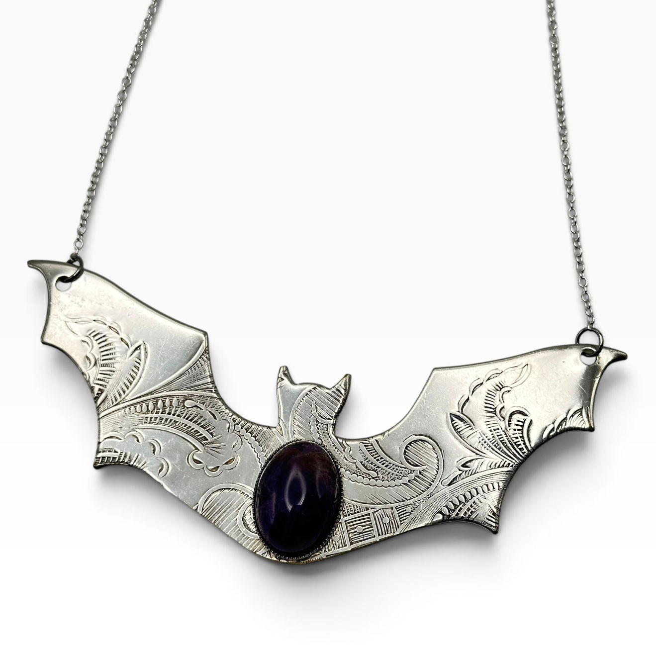 Bat necklace.