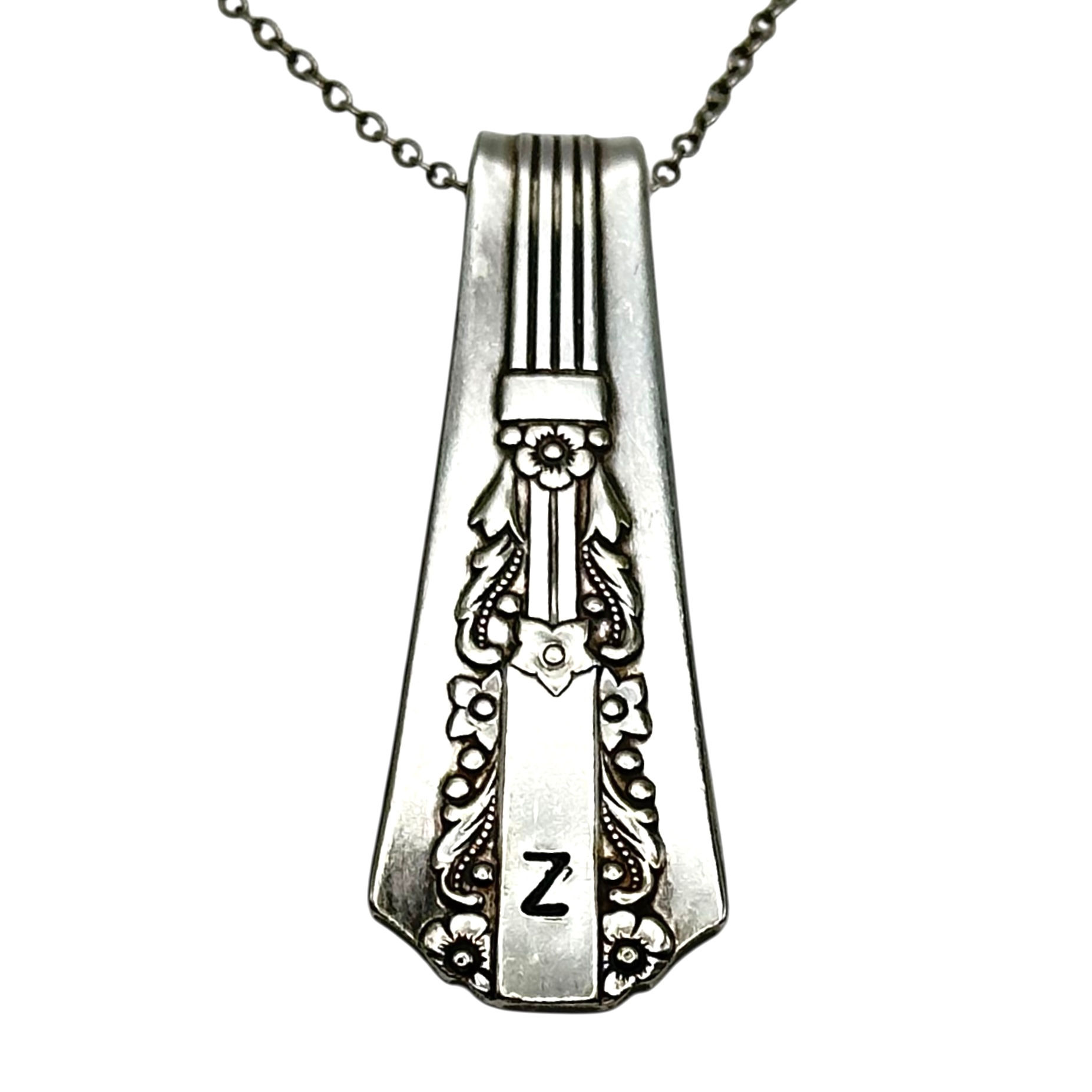 (Z) Monogrammed necklace.