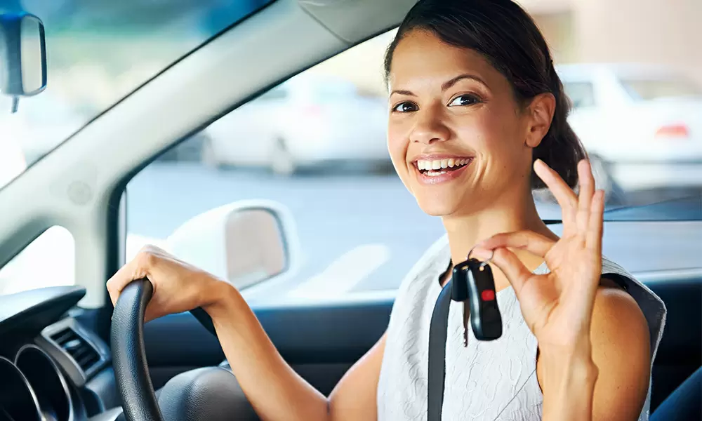 female driver with car keys