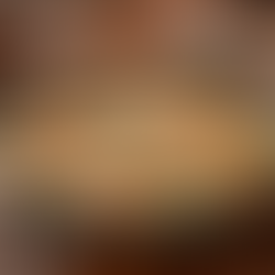 Creamy chicken and spinach served in a skillet on a wooden table