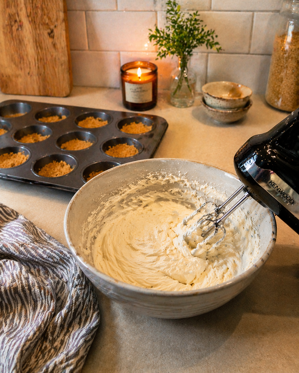 Cream cheese mixture being beaten smooth in a bowl for no-bake Easter cheesecake bites