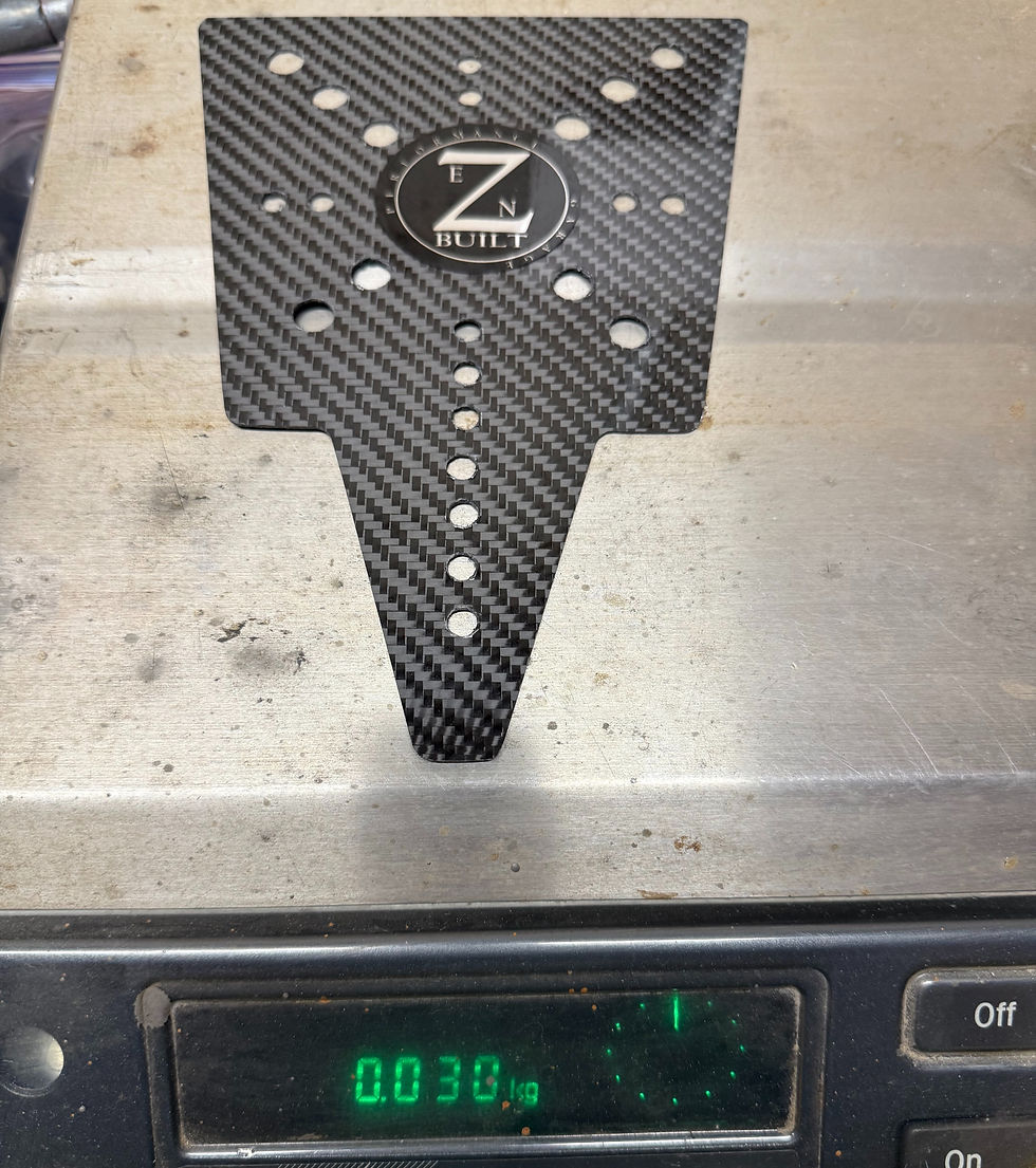 Thumbnail: Carbon fiber LTR 450R Rear Number Plate Bracket on scale, 0.038g