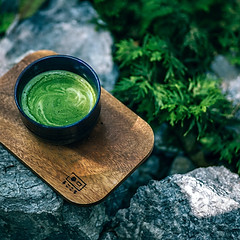 black-cup-on-wooden-board-shallow-focus-