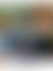 Cup of coffee beside an open Grid Society concept book. Shows a peaceful morning moment and how to start doing inner work through daily reflection.