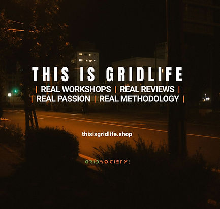 Dark nighttime street scene with the words “THIS IS GRIDLIFE” glowing across the image, symbolising real stories, real workshops, and authentic personal growth experiences within the Grid Society community.