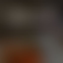 Woman reviewing a workbook and coffee during a Sunday reset routine to reduce Monday anxiety.