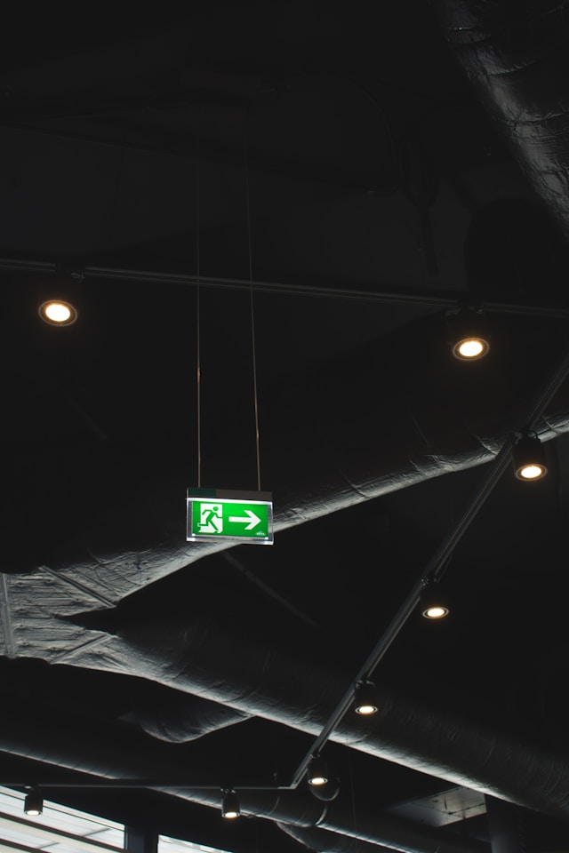 Dark luxury-style interior with dim lighting and reflective surfaces, symbolising the pressure to appear successful, polished, and “put together” in order to keep up with other people’s lifestyles and achievements.