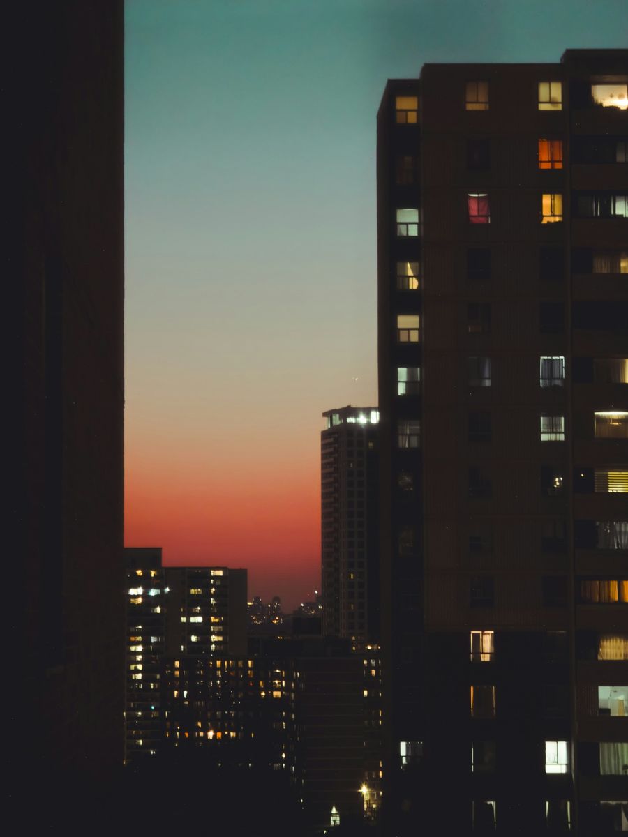 Dark 4 a.m. city skyline symbolising overthinking after comparing yourself to your friends.