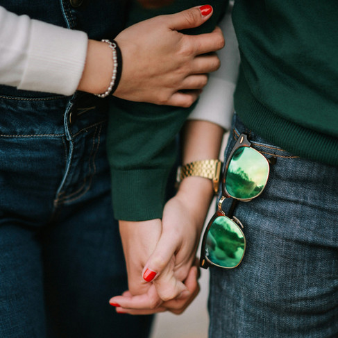 “Close-up of two people holding hands, symbolising connection, trust and the emotional clarity explored in Grid Society’s Your Dating Codes session.”