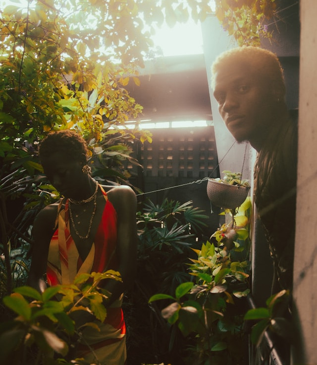 Woman and man in low light emotional setting, reflecting tension and uncertainty in dating, representing overthinking in dating and confusion between lack of interest and “hard to get”