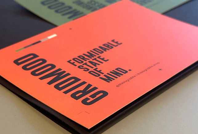 Grid Society workbook with “Formidable State of Mind” cover, showing structured personal development materials