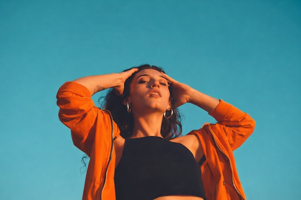 "Woman using Grid Society clear thinking tools in the UK to organize thoughts and reduce mental noise."