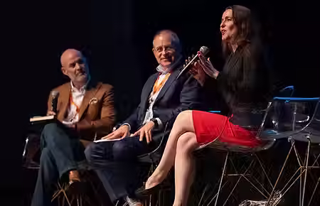two men and a lady at the IP Awareness Summit