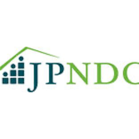 JPNDC logo featuring a green roof, people, and business description.