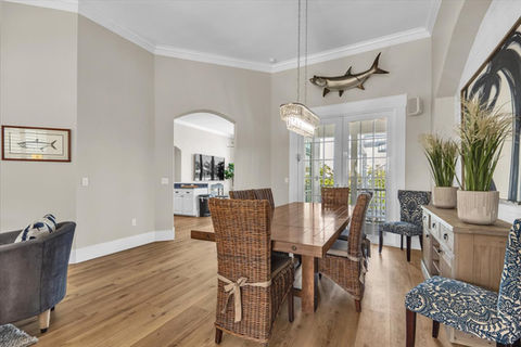 Dining room with wooden table and wicker chairs