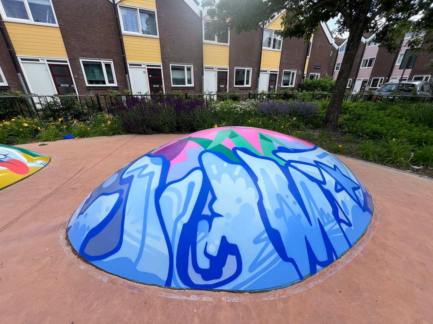 Overview of the revitalized Voortingsplantsoen playground, now featuring bright and playful artwork.