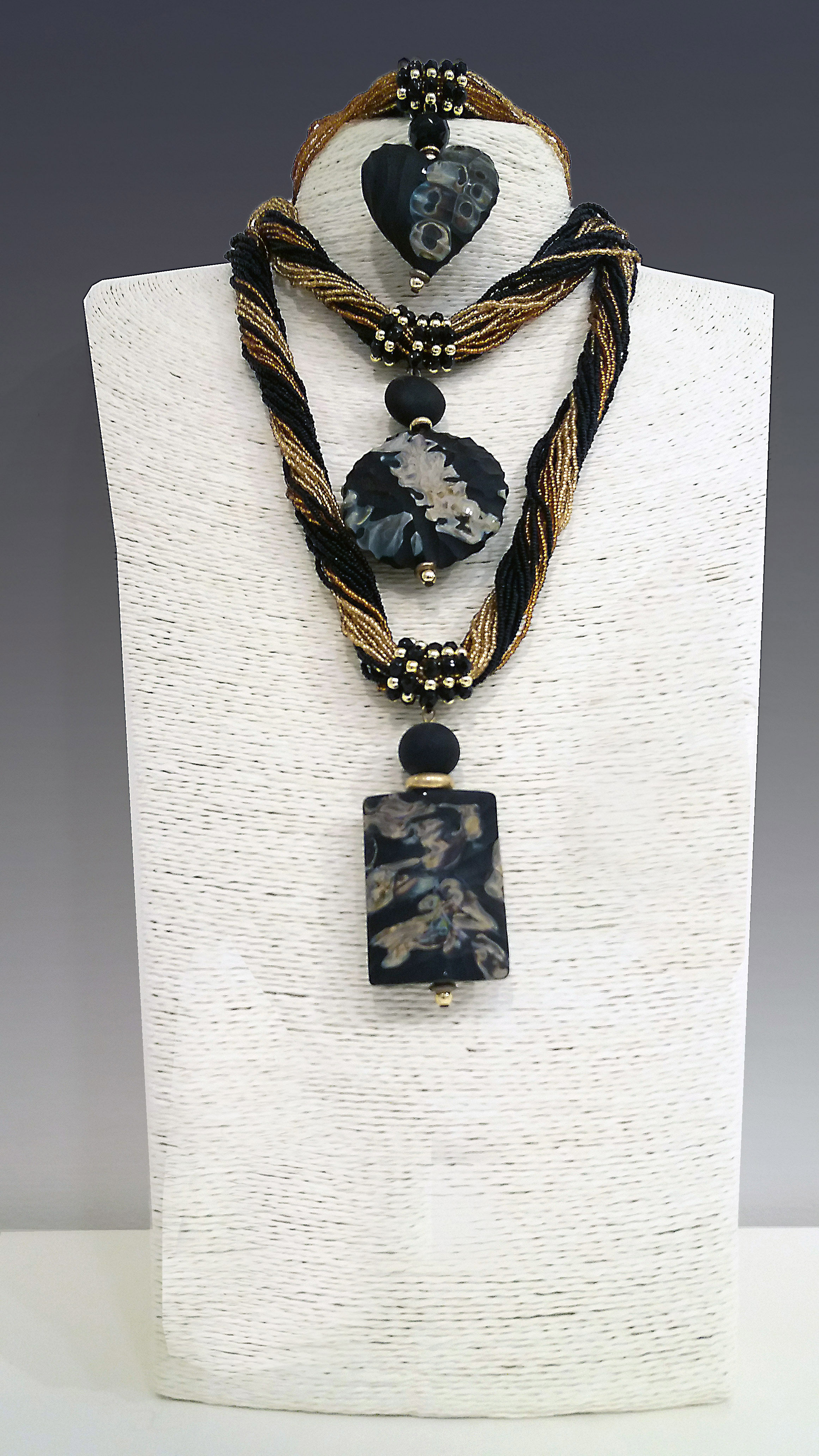 Necklace "Conterie" with different shaped pendants