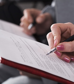 People completing forms