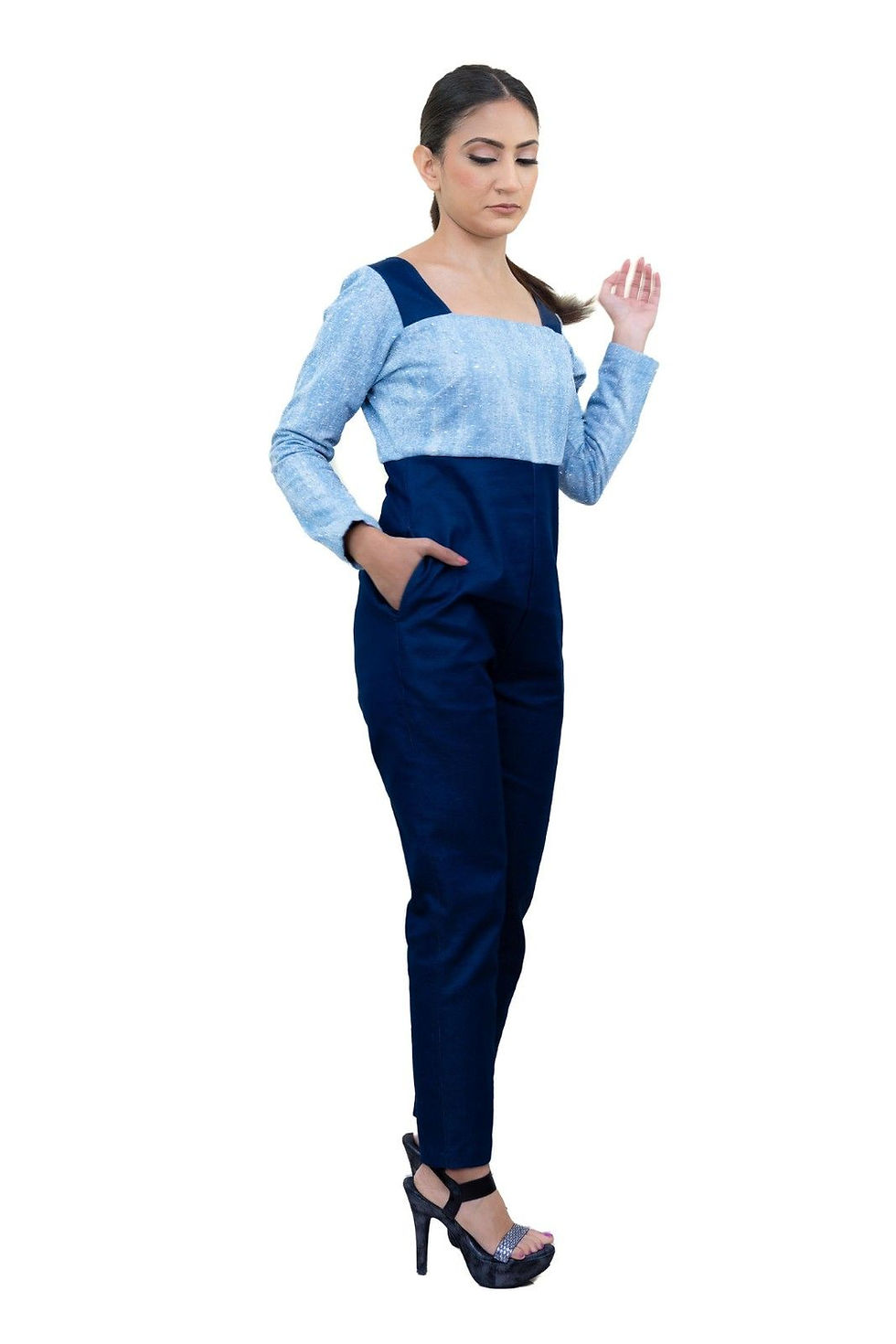 Woman in light blue and navy jumpsuit