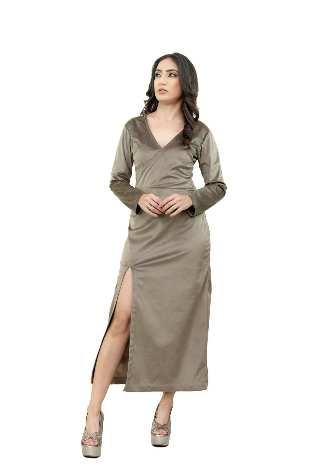 Woman in olive green long-sleeved dress with high slit