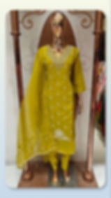 Mustard yellow embroidered cotton suit set on a mannequin
