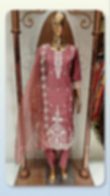 Dusty rose embroidered cotton suit set on a mannequin