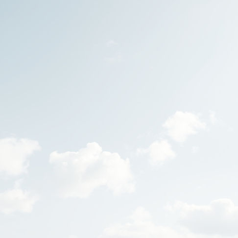create a very pale blue sky with fluffy white clouds.jpg