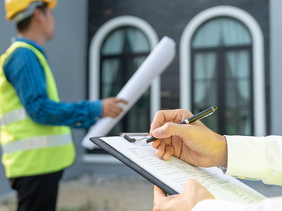 Home inspector taking notes on a clipboard while reviewing a Boise home exterior and plans.