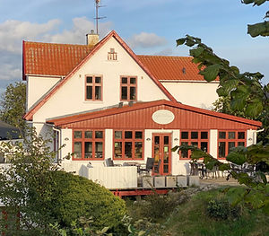 Klippen Grevens Dal i Gudhjem i aftensol