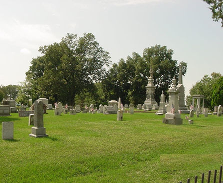 Cemetery with many headstones and trees
