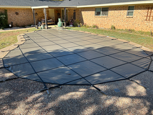 DFW Vinyl Pools - Wichita Falls safety cover installation - Foxx Kidney pool shape with fine mesh cover in tan