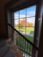 Main staircase obstructing window.