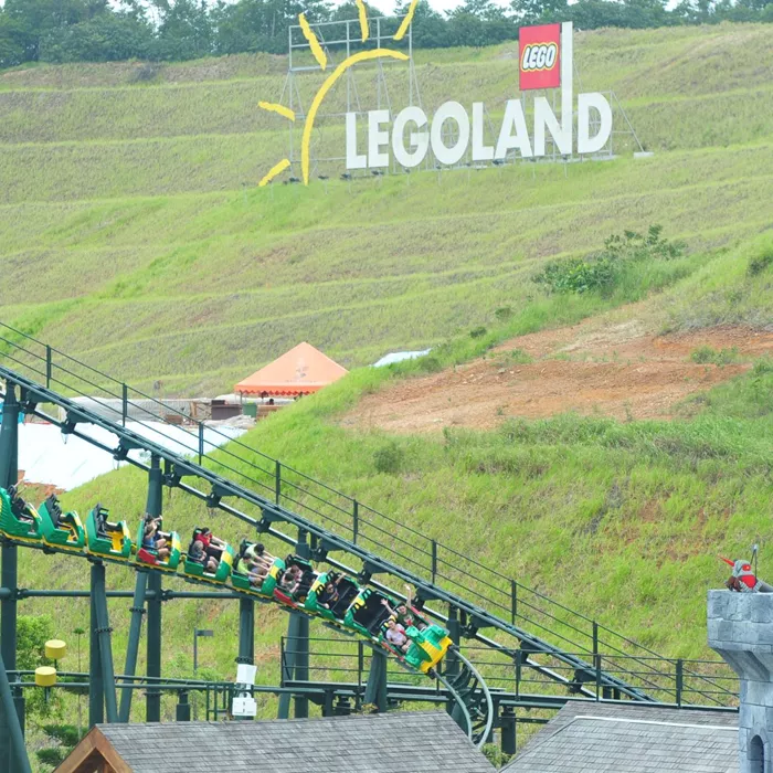 Thrilling roller coaster ride at Legoland Malaysia with dragon-themed twists and turns.