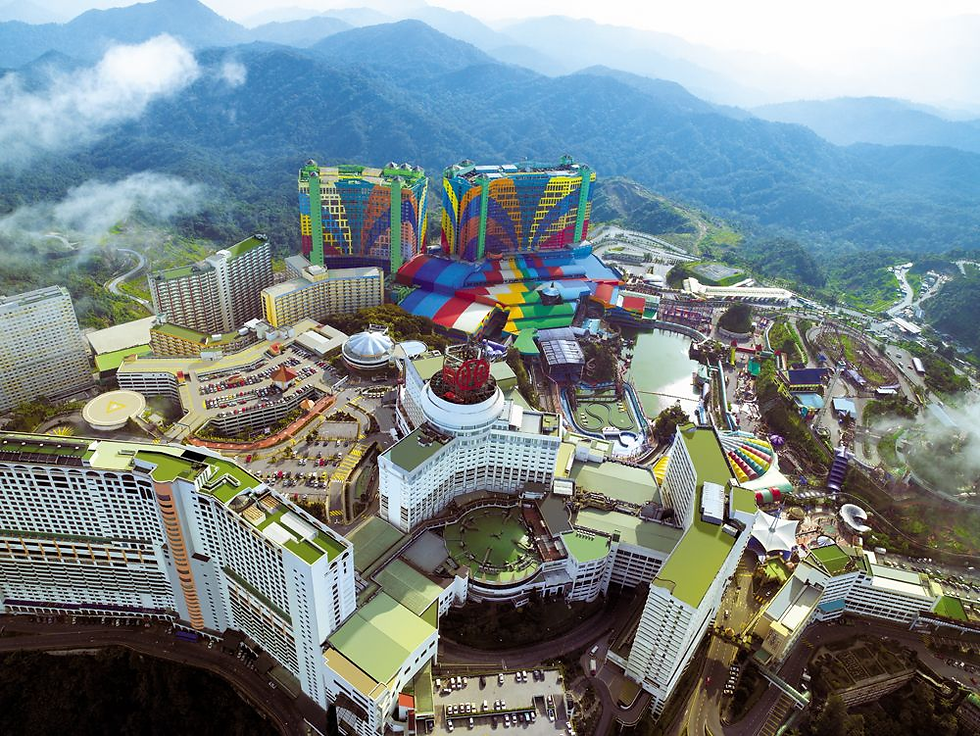 Scenic panorama of Genting Highlands enveloped in mist, nestled within the Titiwangsa Mountains, offering a serene mountain escape.