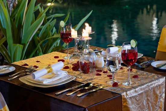 A cozy dining experience under soft candlelight, offering privacy and elegance perfect for celebrating love.